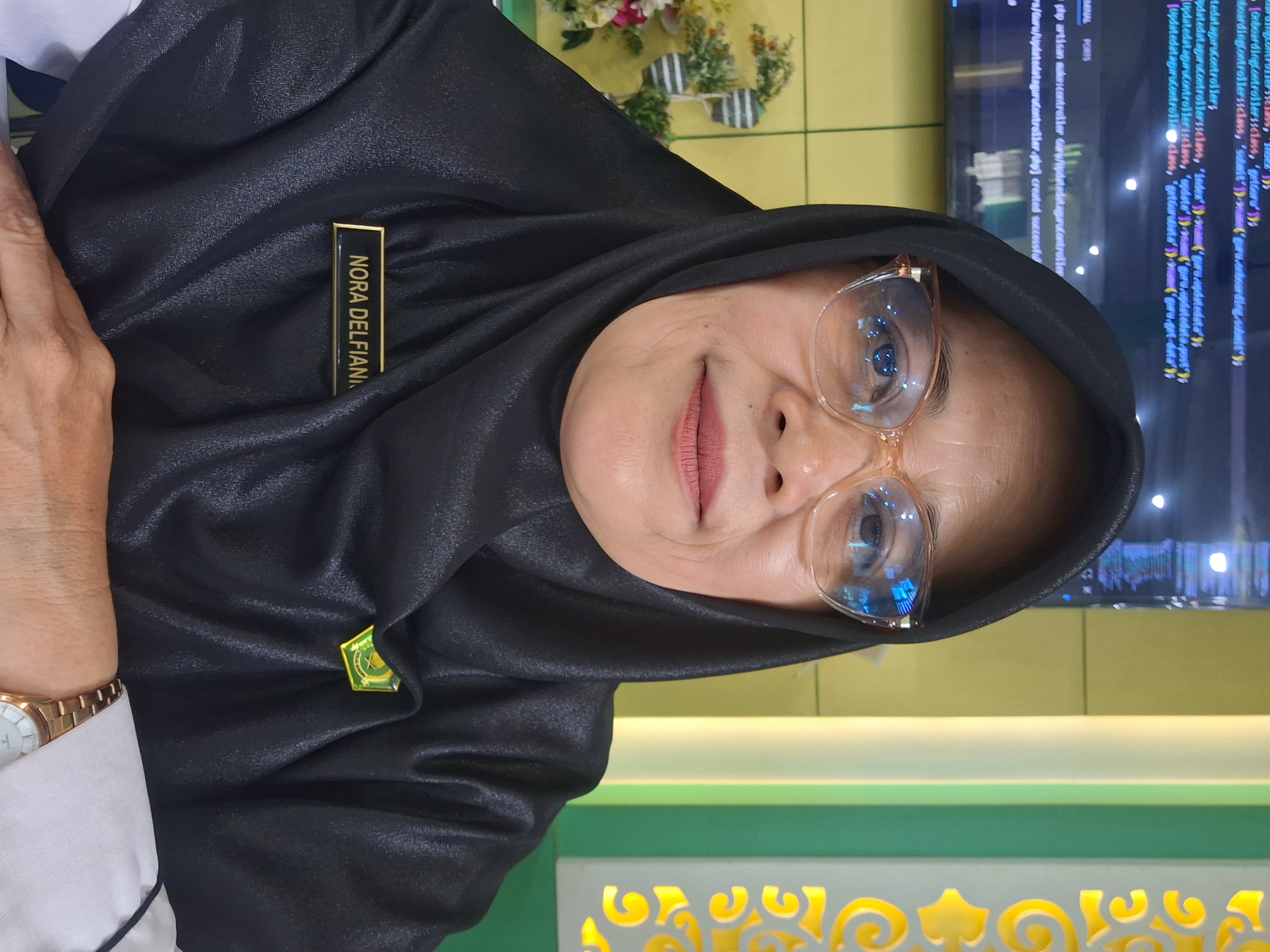 Hj. Nora Delfianis, S.Pd.
